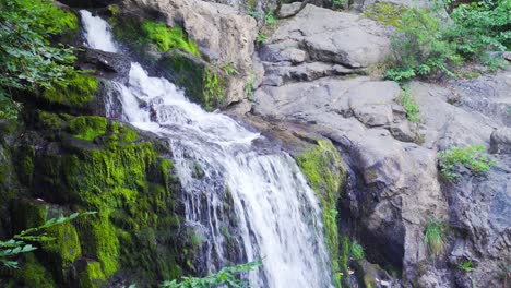 Waterfall-among-mossy-rocks.